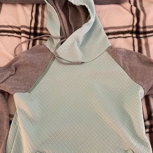 Mint green waffle plaid hoodie with fleece arms.